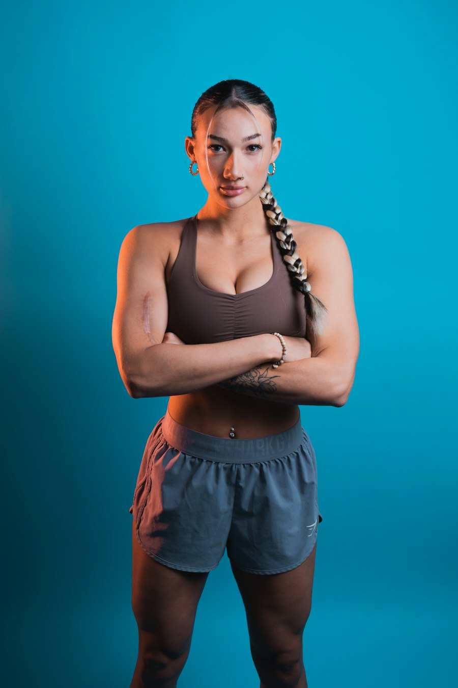 Illustrative portrait of a fitness professional with arms crossed